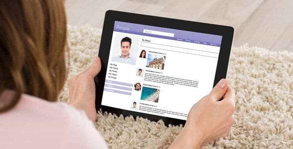 Photo of a woman on an iPad Photo of a woman on an iPad