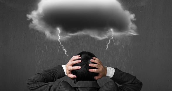 Photo of a rain cloud over a man's head Photo of a rain cloud over a man's head
