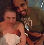 Photo of Amber Soletti with her husband and newborn baby