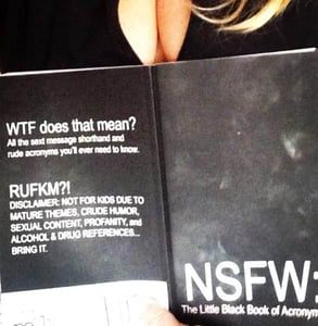 Photo of a woman reading NSFW