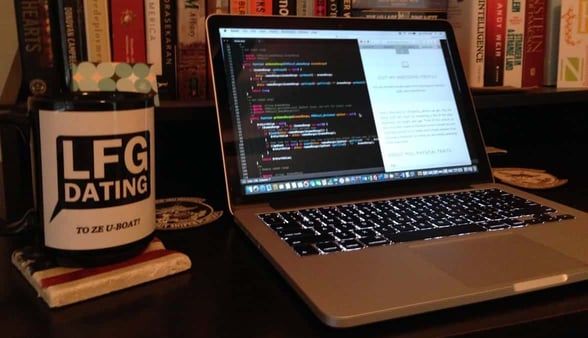 Photo of a LFGdating mug and laptop