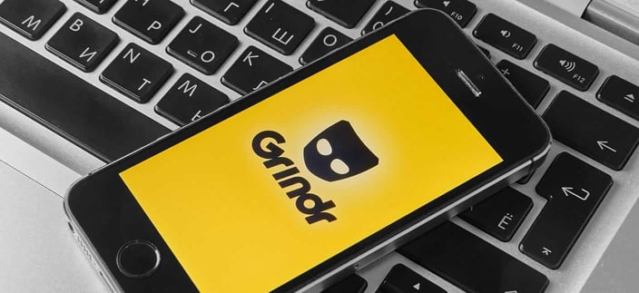 Grindr logo on a phone Grindr logo on a phone