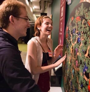 Photo of a couple at a MoMath exhibit Photo of a couple at a MoMath exhibit