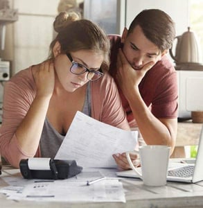 Photo of a couple stressed about money
