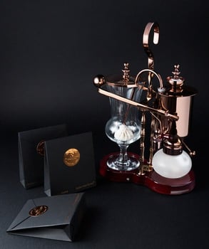 Photo of Black Ivory Coffee and the special coffee brewer Photo of Black Ivory Coffee and the special coffee brewer