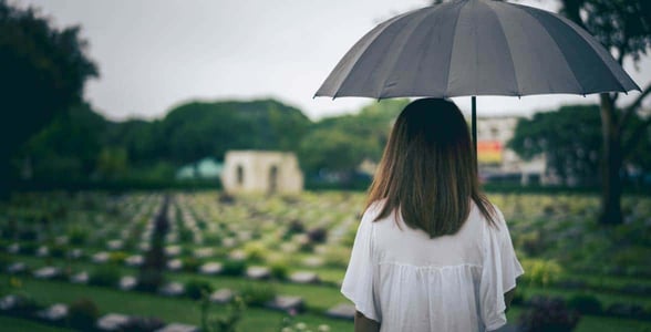 Photo of a woman at a cemetery