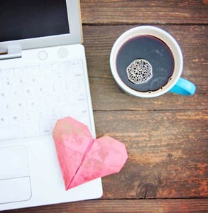 Photo of a computer and a heart