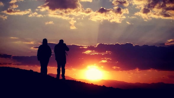 Photo of couples enjoying sunset in Meteora