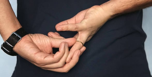 Photo of a man taking off his ring