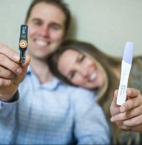 Photo of a couple with a Trak fertility test
