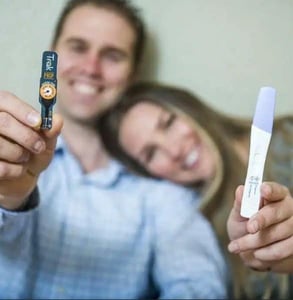 Photo of a couple with a Trak fertility test Photo of a couple with a Trak fertility test