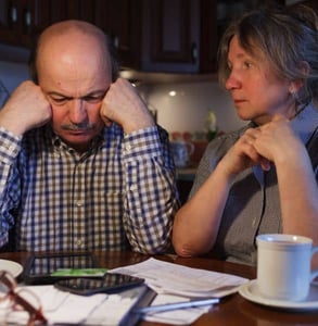 Photo of a couple looking at their finances Photo of a couple looking at their finances
