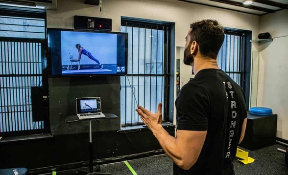 Photo of TS Fitness Founder Noam Tamir conducting a virtual workout Photo of TS Fitness Founder Noam Tamir conducting a virtual workout