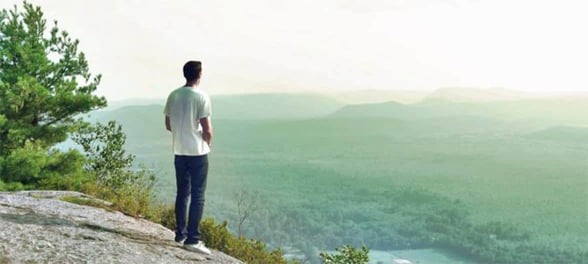 Photo of a man looking at mountains Photo of a man looking at mountains