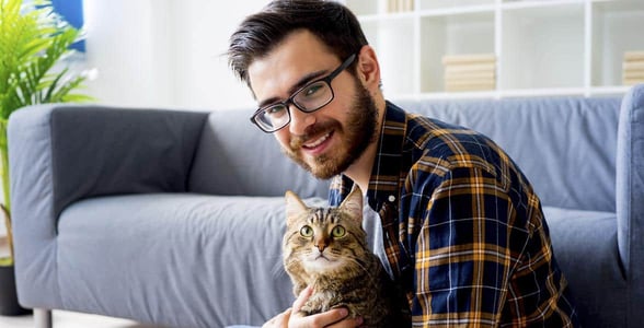 Photo of a man with a cat