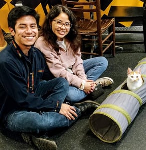 Photo of a couple adopting a cat Photo of a couple adopting a cat