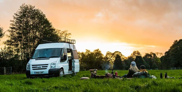 Photo of a couple with a campervan Photo of a couple with a campervan