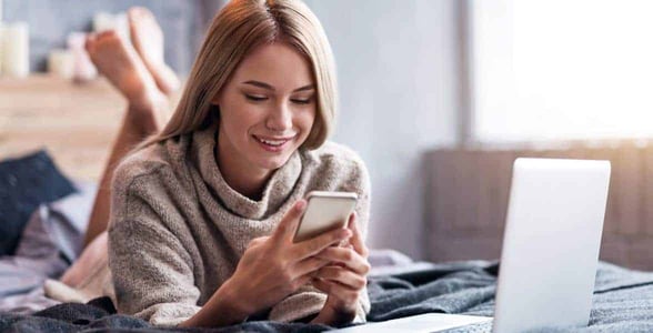 Photo of a woman on her phone Photo of a woman on her phone