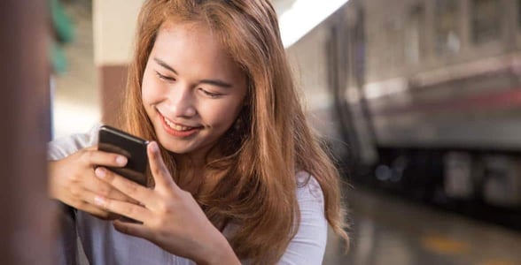 Photo of a woman on her phone Photo of a woman on her phone