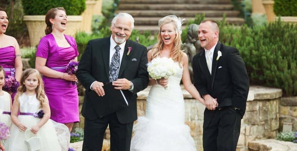 Photo of Marty and a newly married couple Photo of Marty and a newly married couple