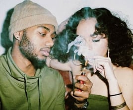 Screenshot of couple smoking from website. Screenshot of couple smoking from website.