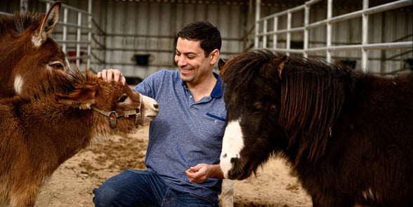 Photo of a man with animals