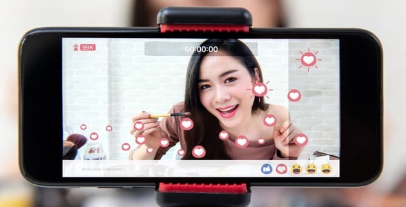 Photo of woman livestreaming Photo of woman livestreaming