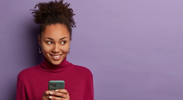 Photo of a woman on her phone Photo of a woman on her phone