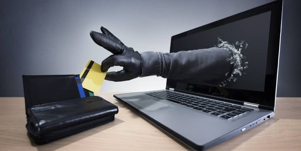 hand reaching into wallet through computer hand reaching into wallet through computer