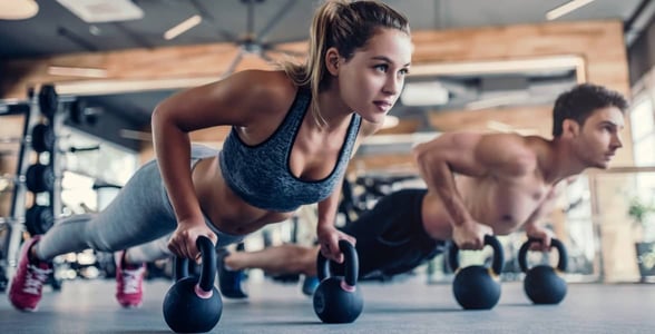 woman and man doing planks