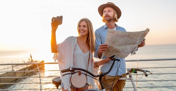 couple standing with bikes