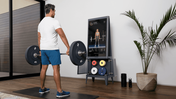Photo of a man lifting weights in home