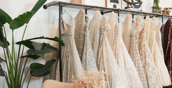 Photo of wedding gowns on rack Photo of wedding gowns on rack