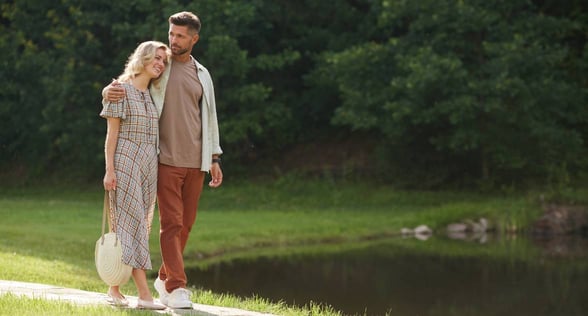 couple walking by lake couple walking by lake