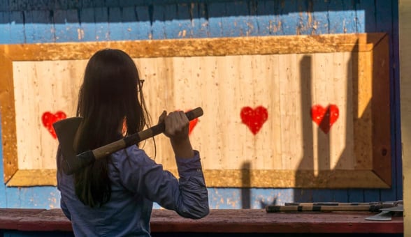 woman throwing axe woman throwing axe