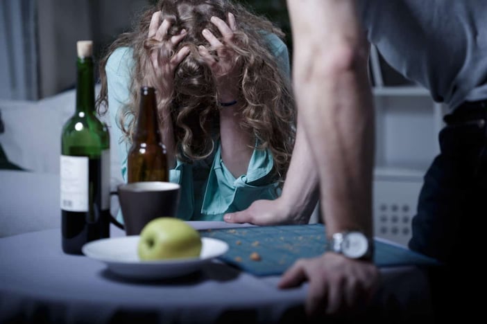 Drunk aggressive husband and his scared wife
