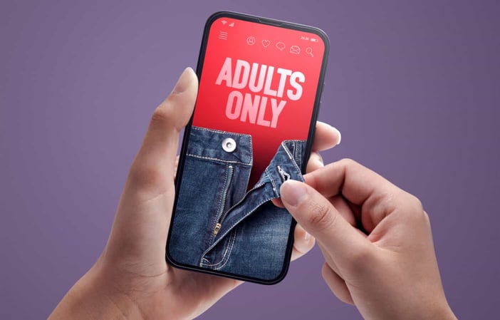 Hands opening phone with pants zipper Hands opening phone with pants zipper