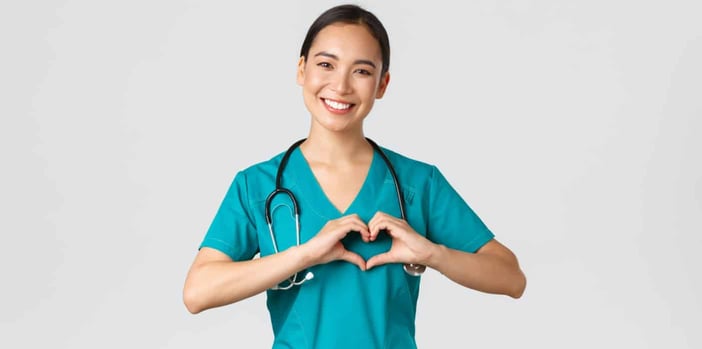 Nurse making a heart sign