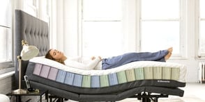 woman laying on a bed woman laying on a bed