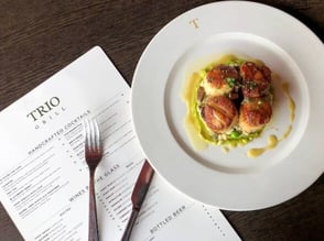 fancy dish with a menu beneath it fancy dish with a menu beneath it