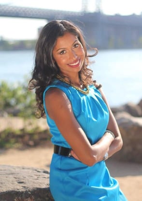 sarika jain smiling at the camera in a blue dress sarika jain smiling at the camera in a blue dress