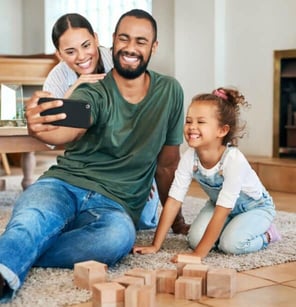 man takes selfie with his family