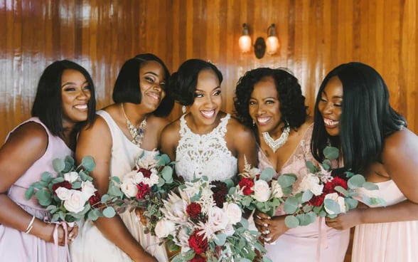 smiling bride and bridesmaids smiling bride and bridesmaids
