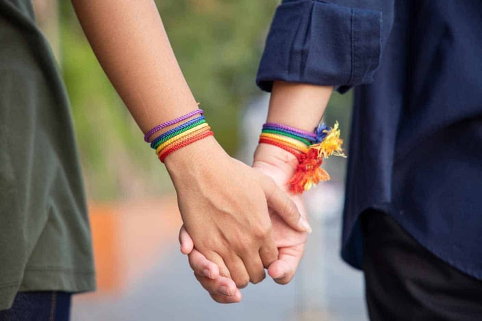 Photo of LGBT couple holding hands Photo of LGBT couple holding hands