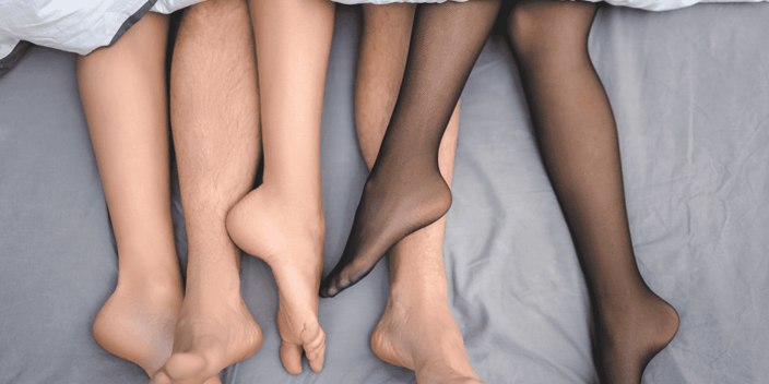 Three pairs of legs in a bed Three pairs of legs in a bed