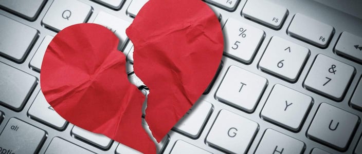 broken heart on keyboard due to romance scam