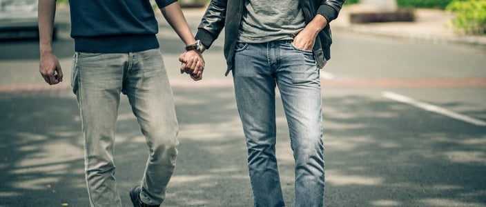 Two men holding hands
