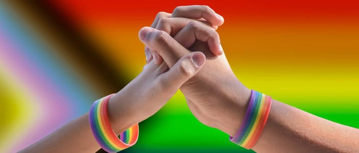 LGBTQ couple holding hands