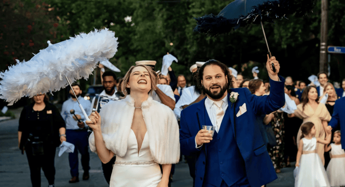 bride and groom with festive umbrellas bride and groom with festive umbrellas