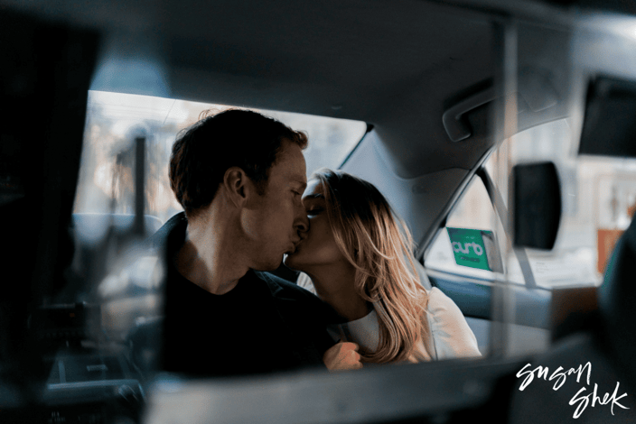 Susan Shek photograph of a couple's engagement shot in the back of a NYC cab Susan Shek photograph of a couple's engagement shot in the back of a NYC cab